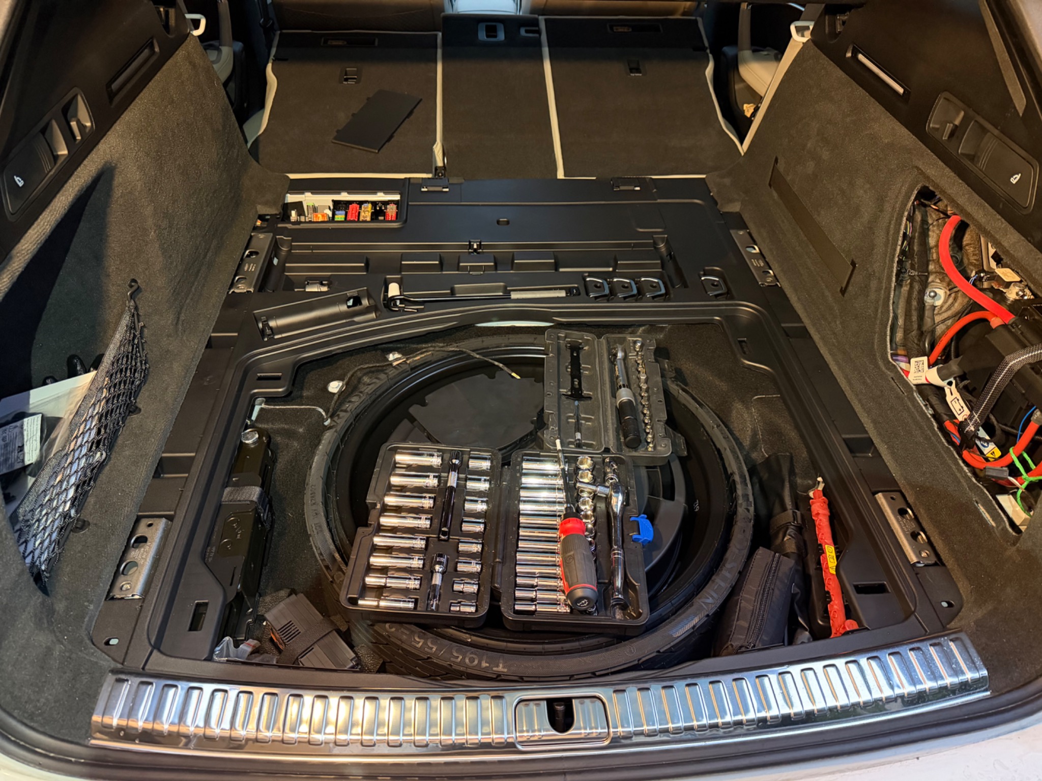 A6 Allroad cargo area dismantled to access electronics beneath the trunk floor