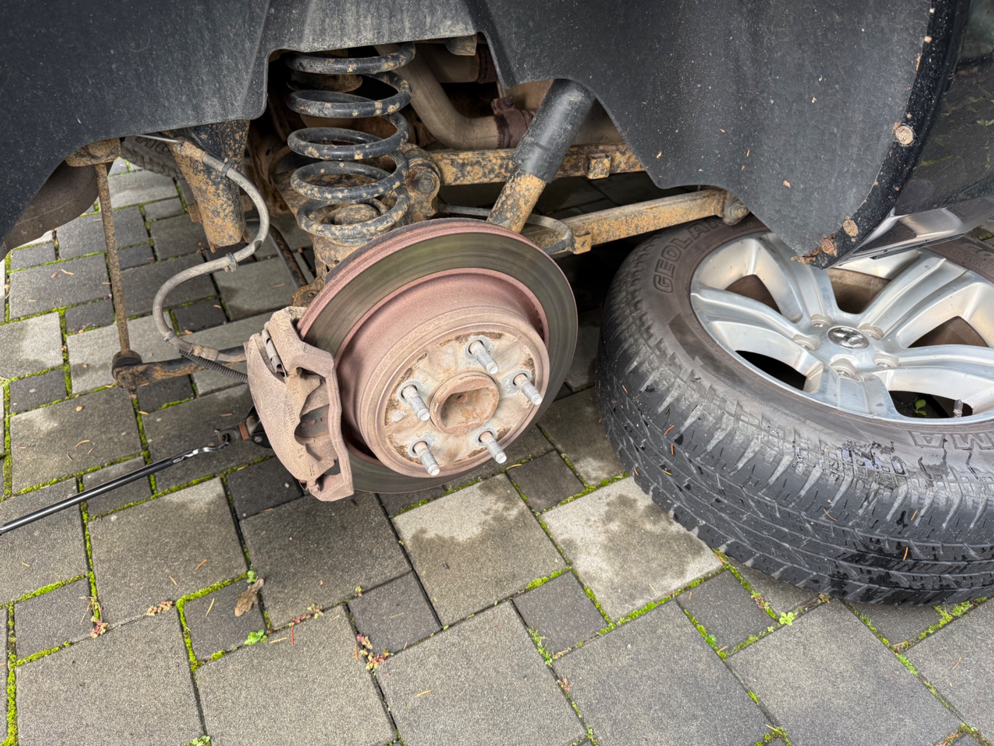 Ram 1500 brake rotor and caliper with the wheel removed
