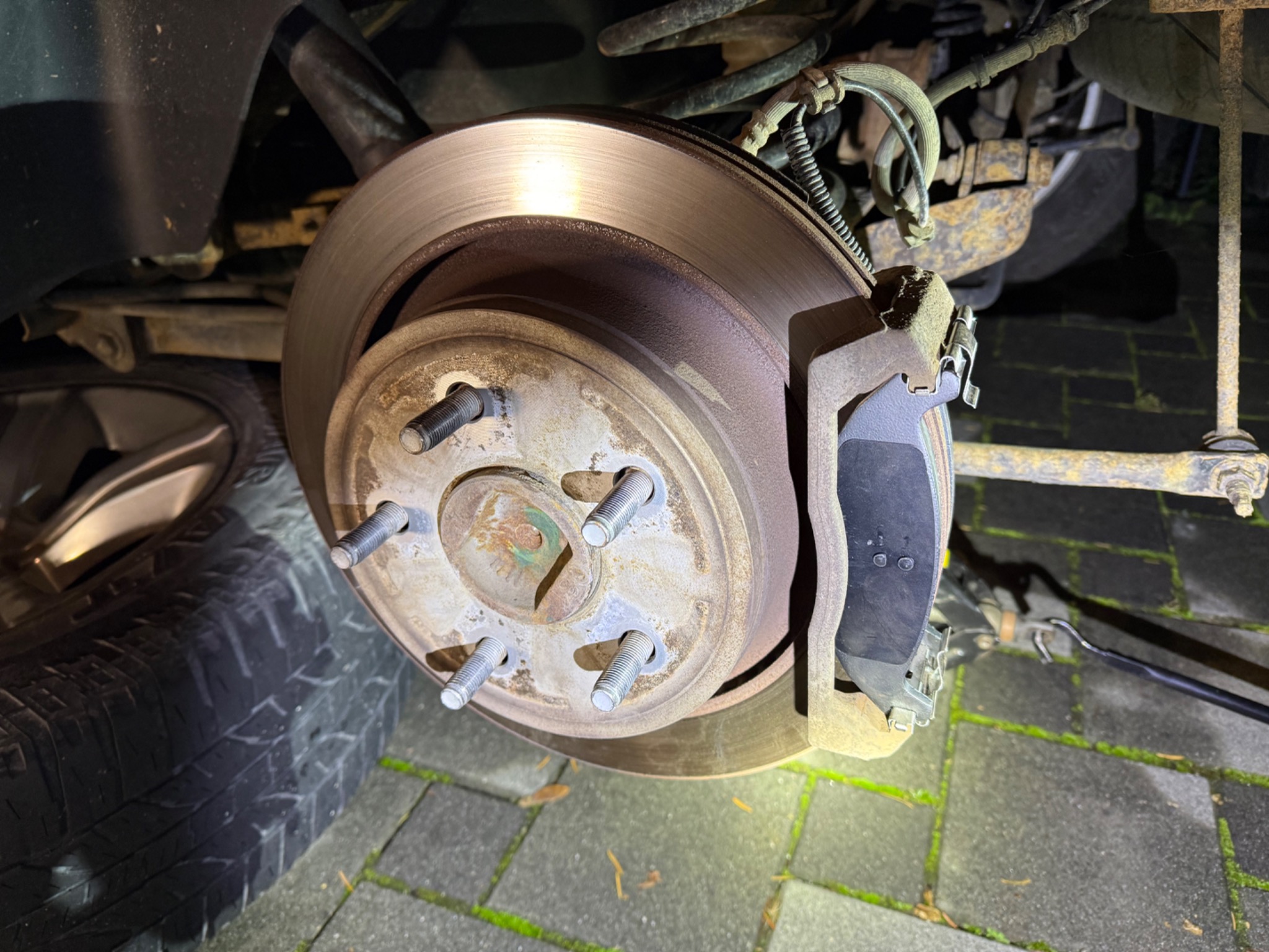 New brake pad installed in the Ram 1500 caliper