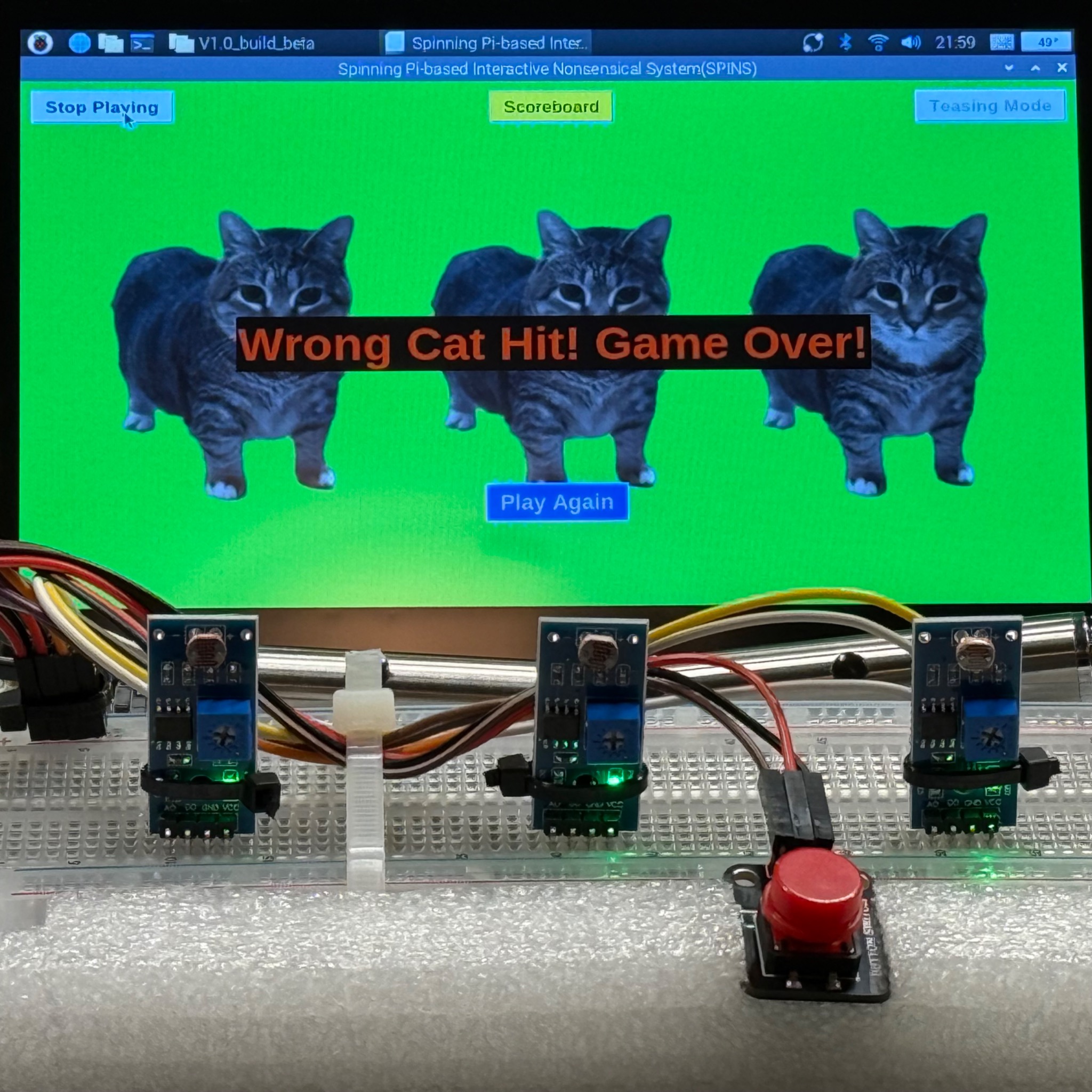 S.P.I.N.S. prototype with its game interface, sensors, and push button